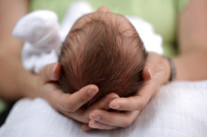 Newborn baby in his mothers safe hands